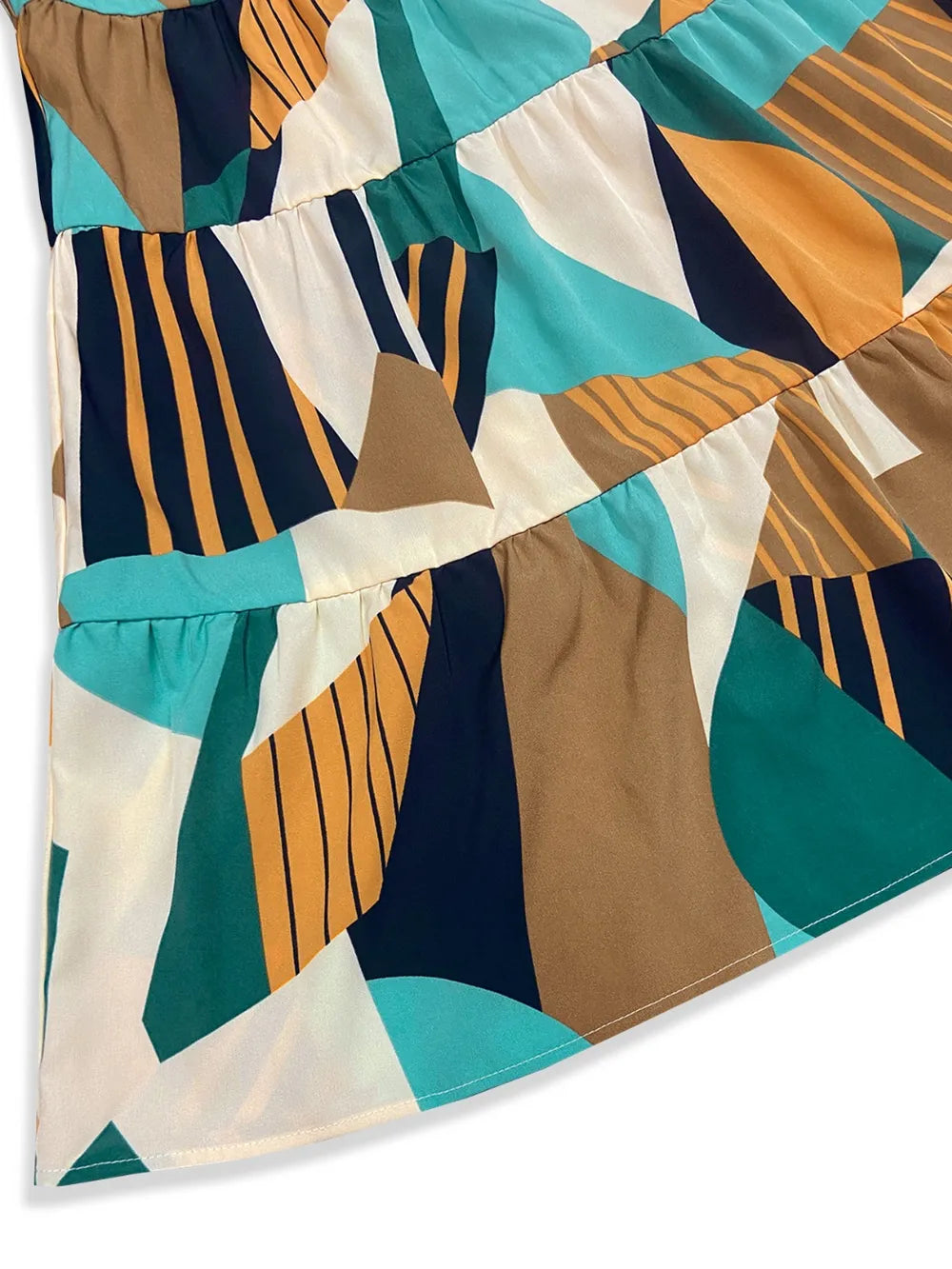 Printed mock-neck mini dress in teal, navy, orange and white abstract print