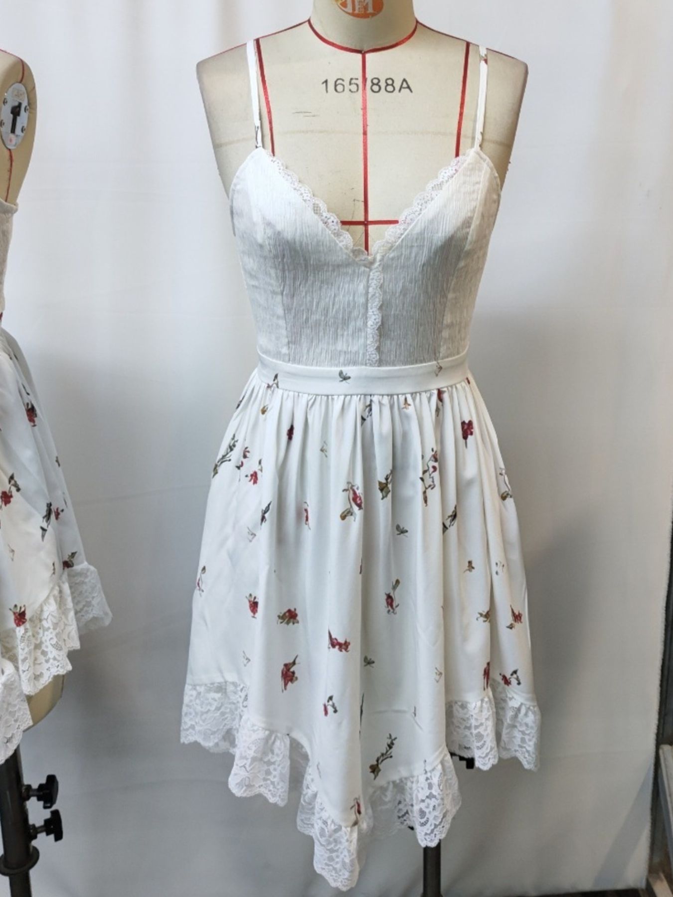 Floral print lace-trim cami dress with asymmetrical hem, white satin-like fabric