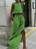 Sleeveless crop top and slit pants set in lime green; two-piece outfit.