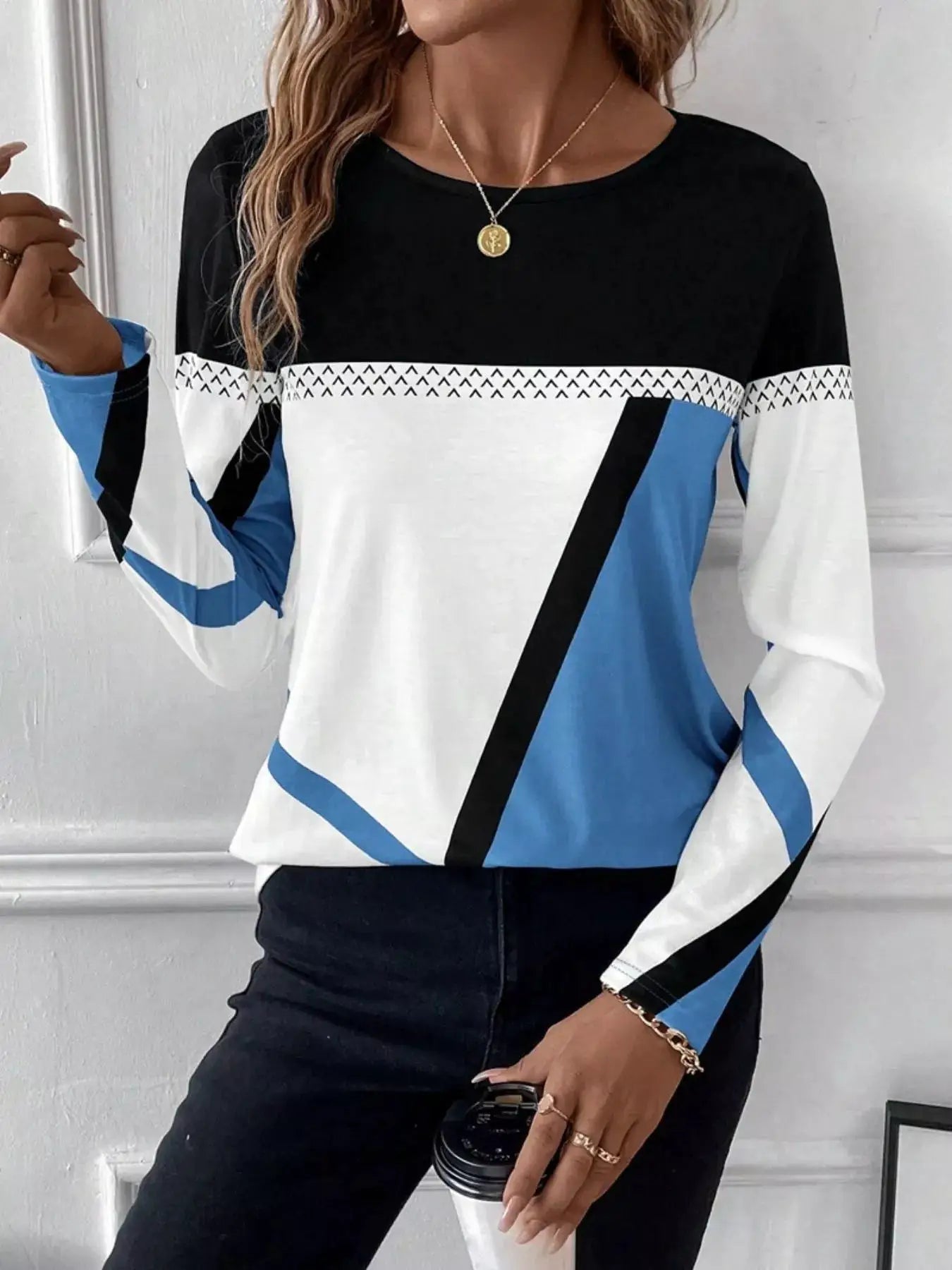 Color Block Long Sleeve T-Shirt with black upper, white middle, blue panels and a triangle-pattern stripe across the chest