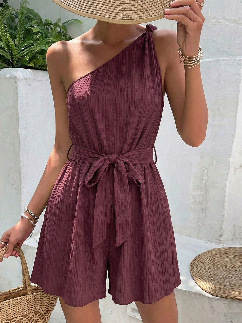 One-Shoulder Tie Waist Romper in burgundy with textured crinkled fabric.