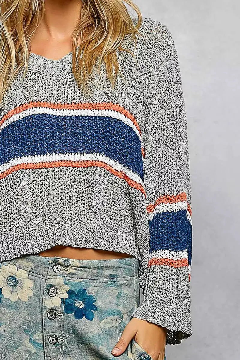 POL V-Neck striped cropped knit top with cable knit detail in gray with blue, white, and orange stripes