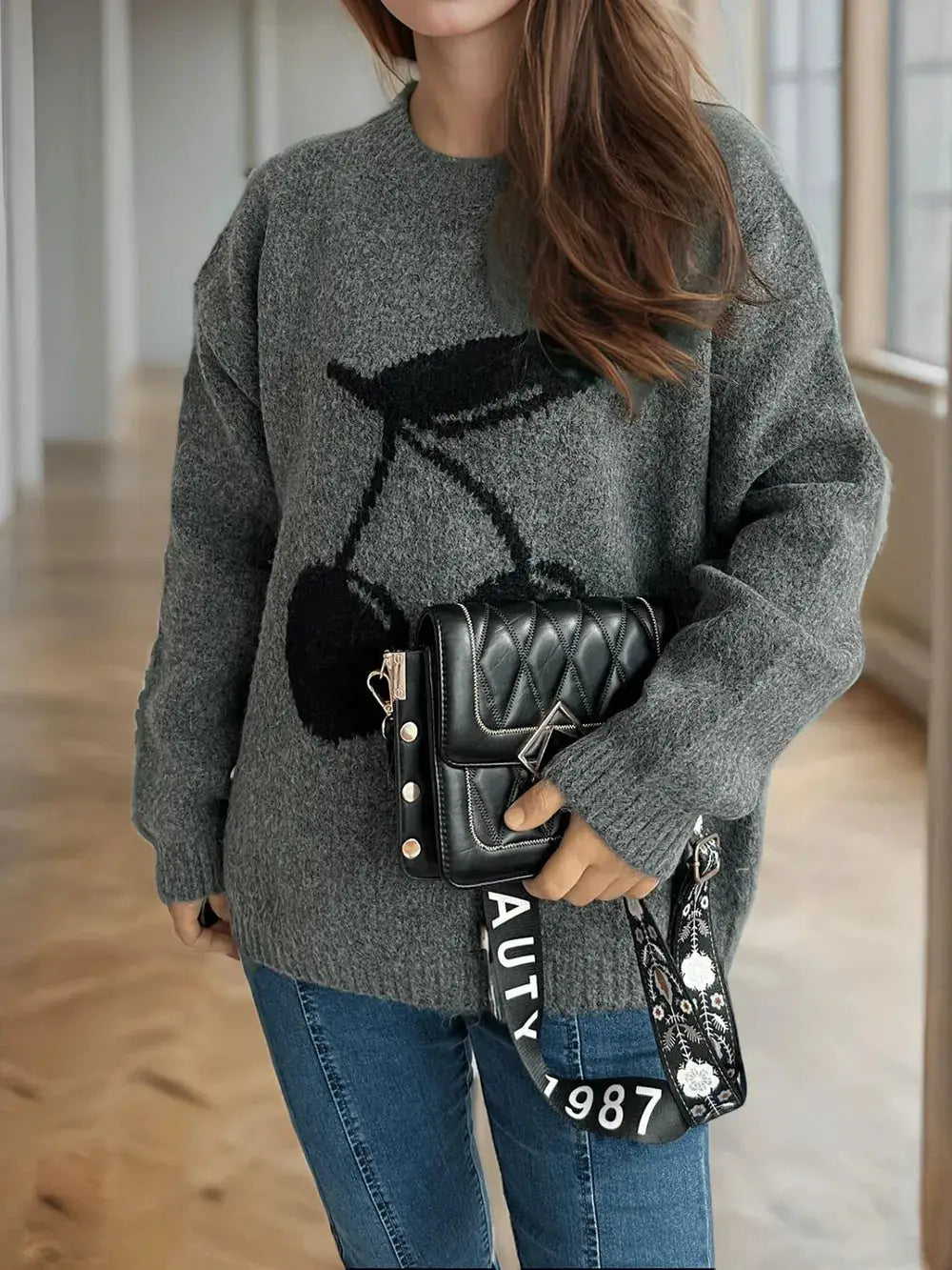 Cherry Round Neck Long Sleeve Sweater gray knit with a bold black bicycle graphic.
