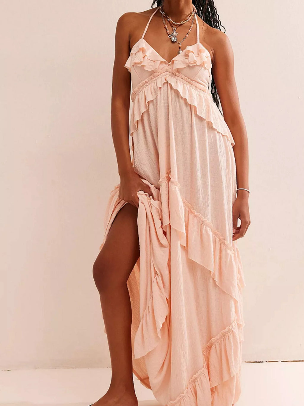 Ruffled halter-neck maxi dress with tied straps in peach by Belle Bijouix, tiered flowy skirt
