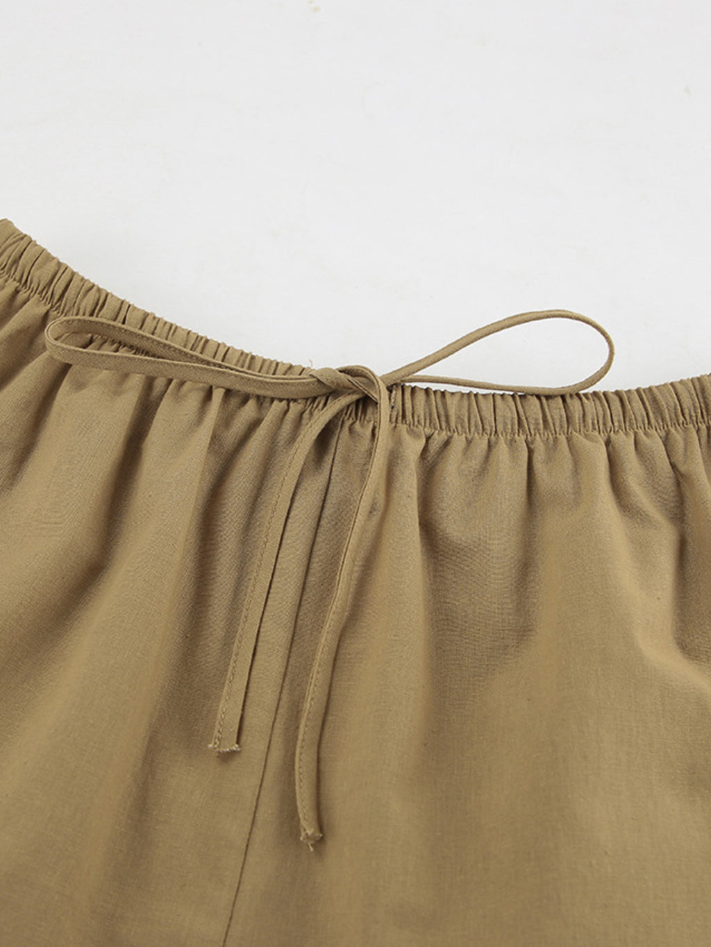 Long-sleeve top and shorts set by Belle Bijouix in tan with drawstring waist