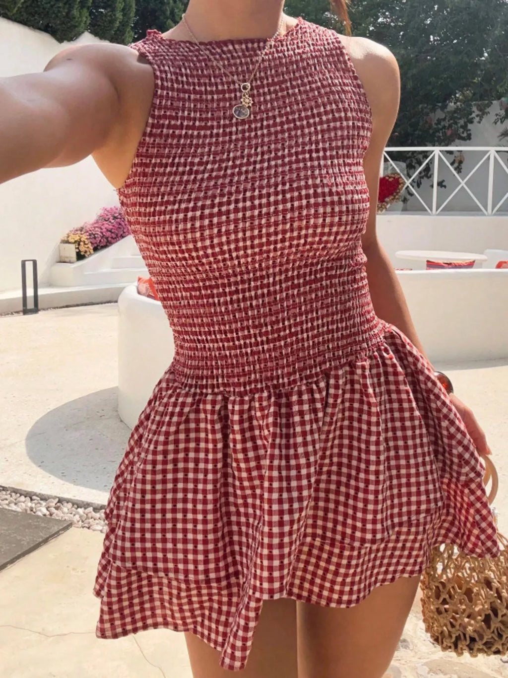 Gingham smocked mini dress in red and white with a tiered ruffle hem