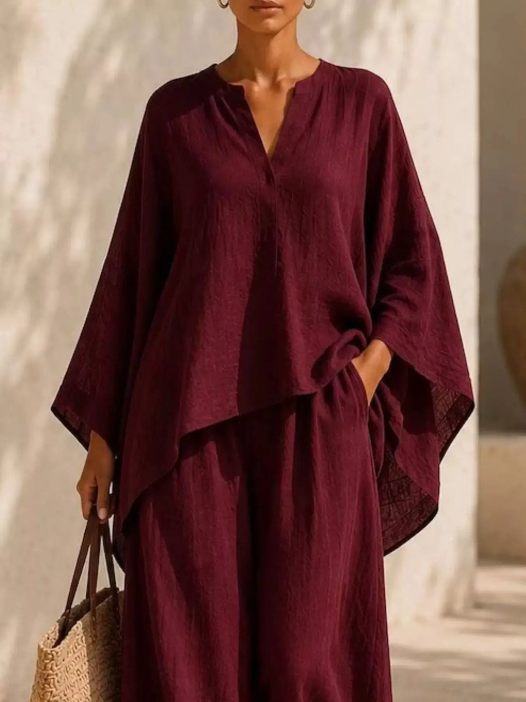 Plus Size Notched Long Sleeve Top & Wide-Leg Pants Set by Belle Bijouix in burgundy; loose, draped silhouette