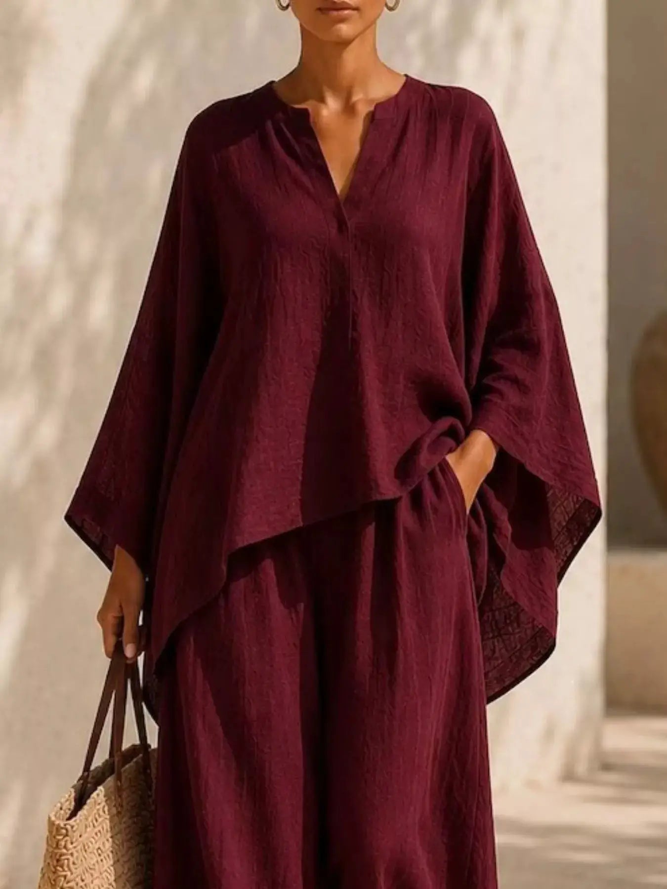 Plus Size Notched Long Sleeve Top & Wide-Leg Pants Set by Belle Bijouix in burgundy; loose, draped silhouette