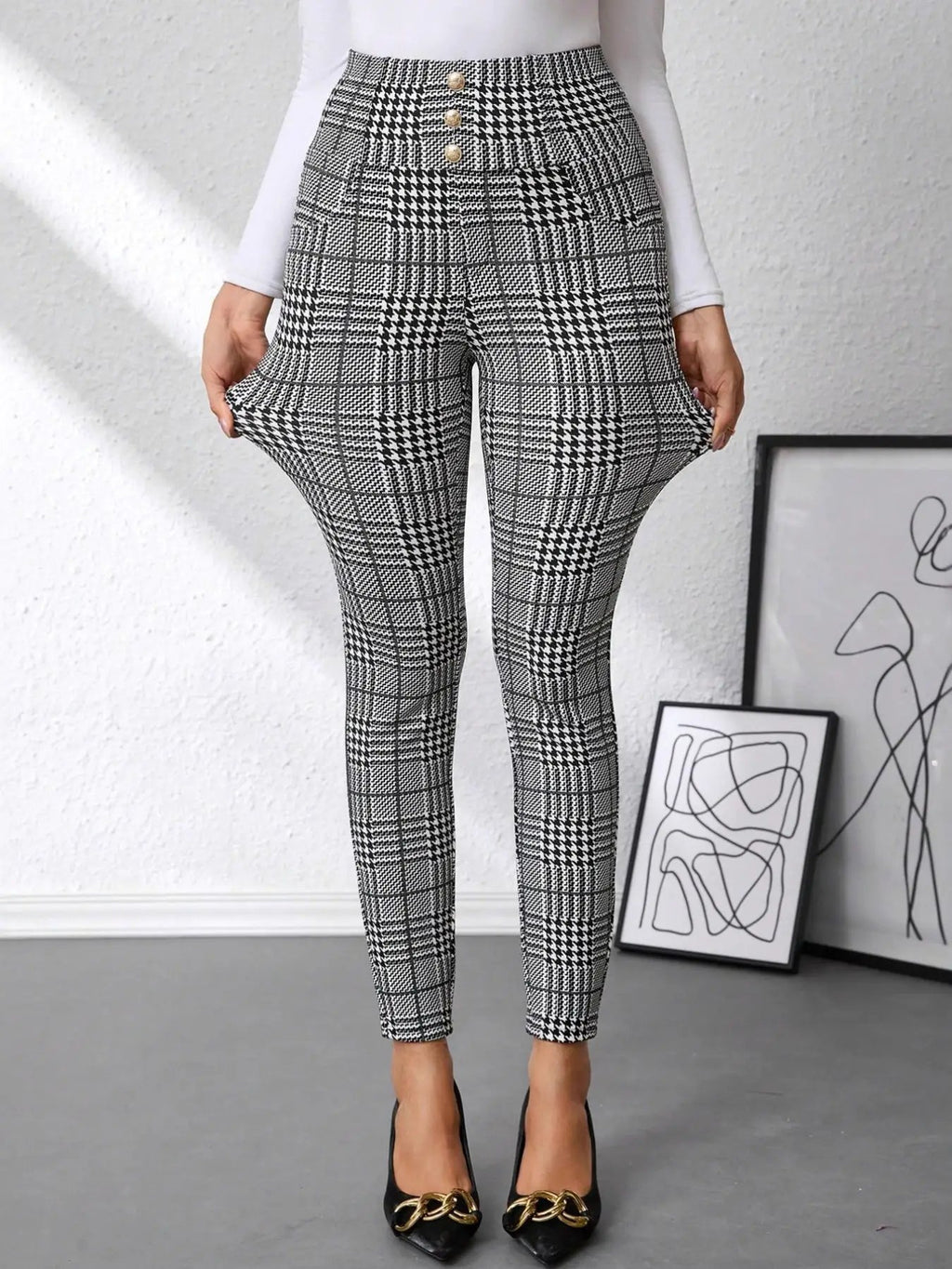 High waist plaid slim-fit pants in black-and-white with gold button accents