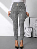 High waist plaid slim-fit pants in black-and-white with gold button accents