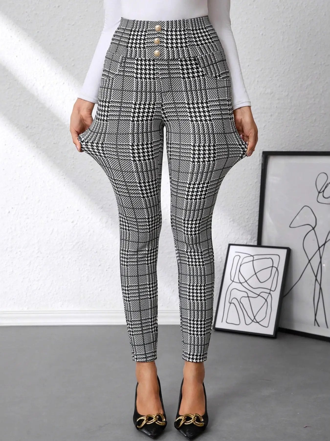 High waist plaid slim-fit pants in black-and-white with gold button accents