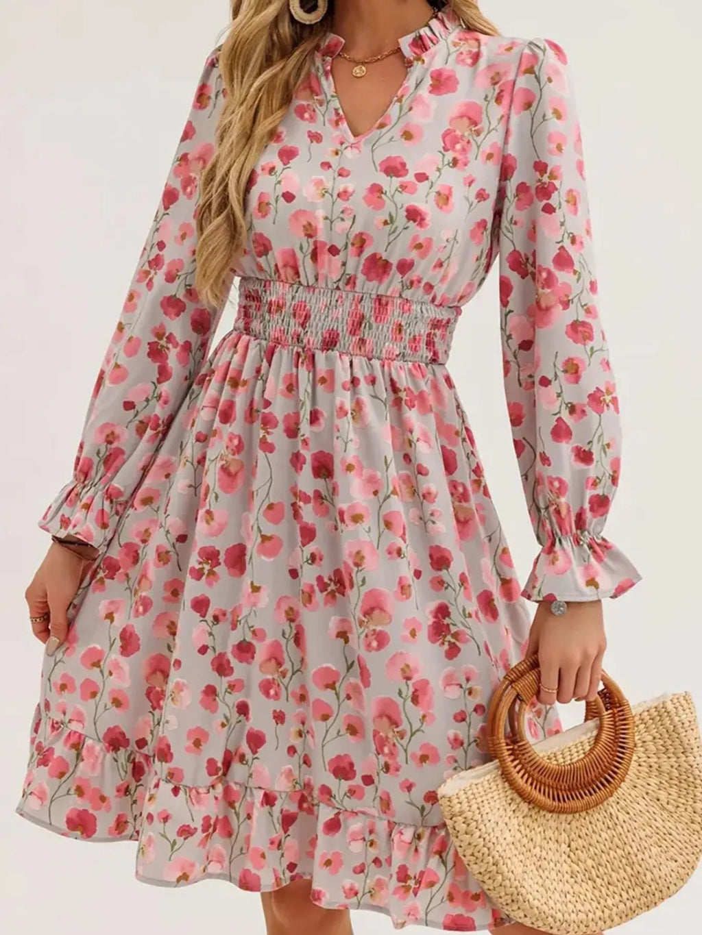 Floral print dress with smocked waist, flounce sleeves, and a ruffled hem in pink flowers on gray.