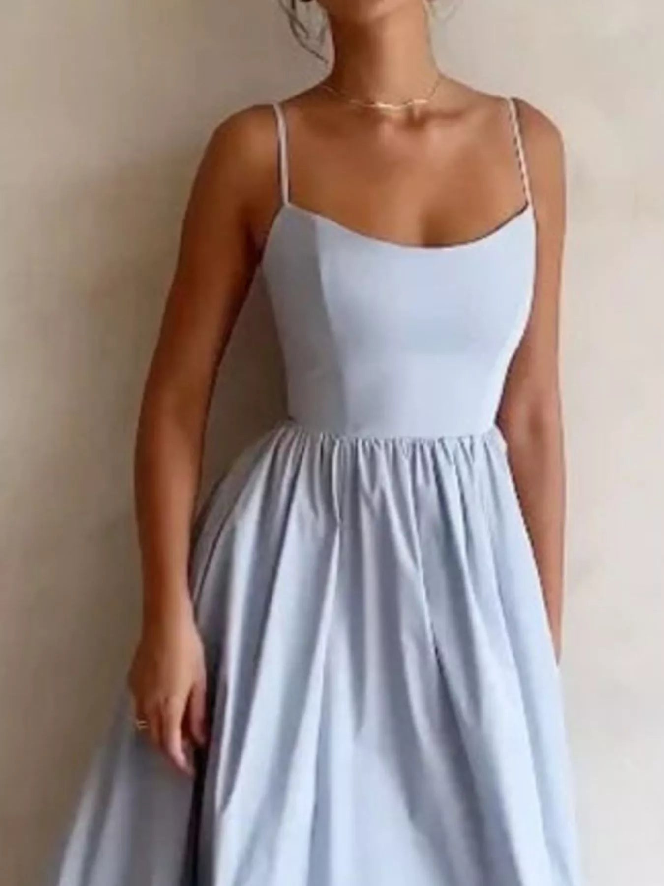 Adjustable-strap scoop-neck midi dress in light blue with a full, flowing skirt