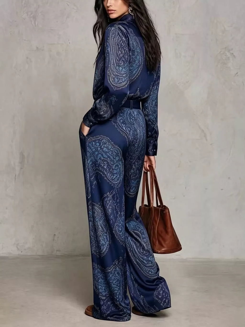 Rear three-quarter view of dark blue paisley shirt and wide-leg pants set