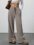 Relaxed-fit drawstring joggers in taupe ribbed knit with pockets
