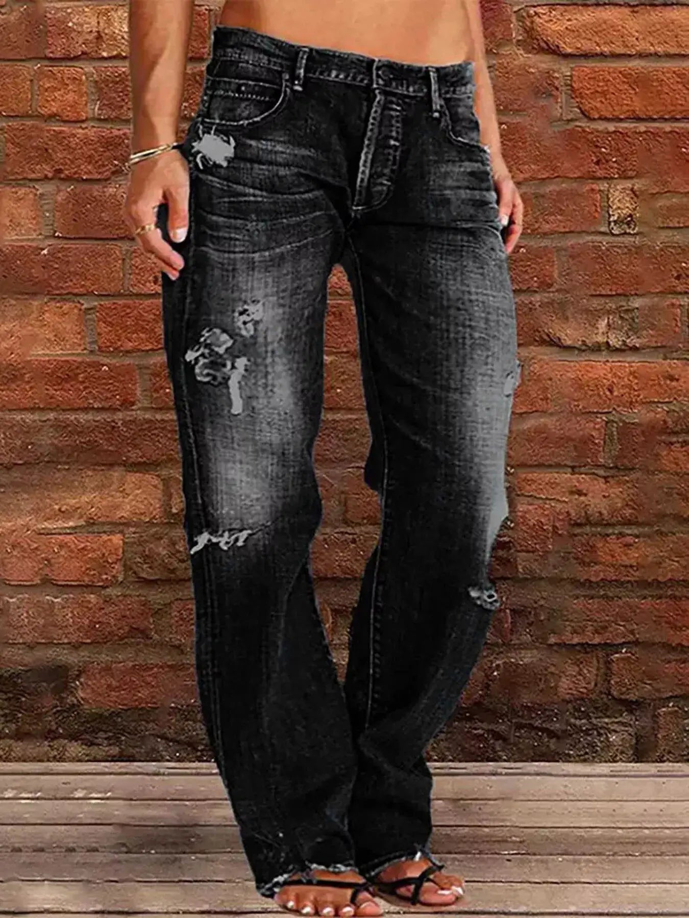 Distressed loose-fit jeans by Belle Bijouix, black denim with ripped detailing