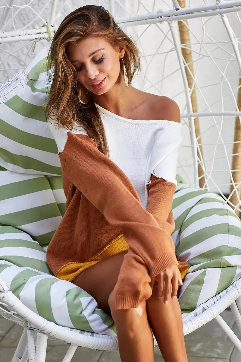 BiBi Color Block Geometric Sweater top with white body, burnt orange sleeves, and mustard hem
