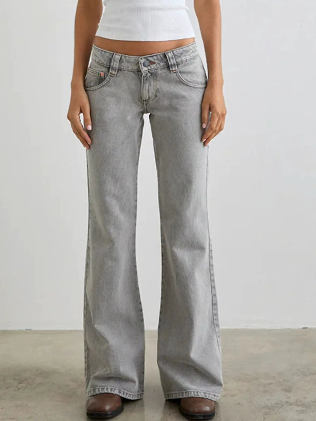 Low Rise Flare Leg Jeans in light gray denim with front pockets and button closure