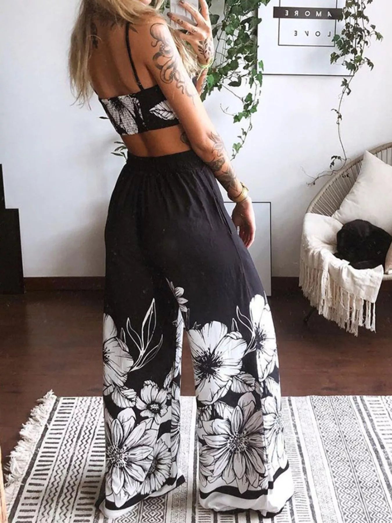 Boho butterfly-print top and pants set; black with large white floral print on wide-leg pants