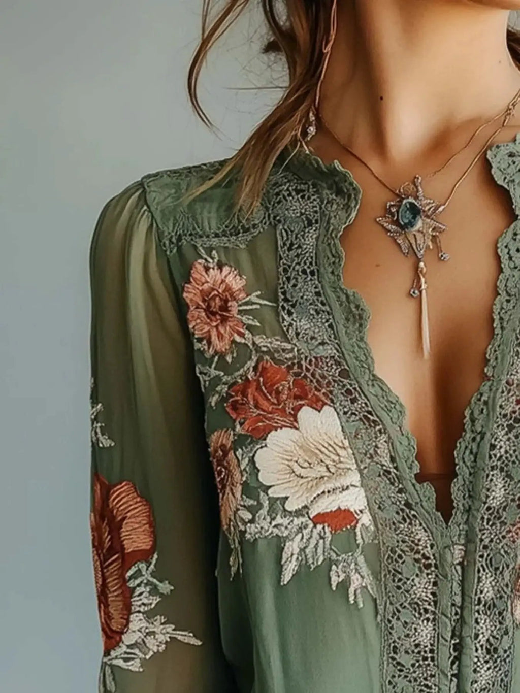 Lace Detail Floral Blouse in olive green with sheer sleeves, romantic floral embroidery, deep V-neck with lace trim.