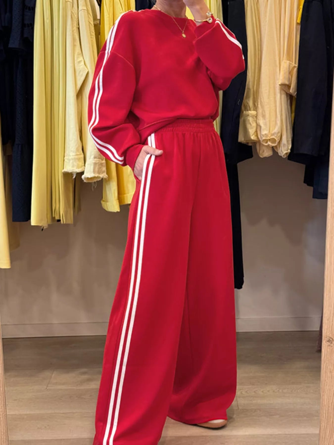 Red striped-detail 2pc activewear set: crewneck top with white sleeve stripes and elastic waist sweatpants