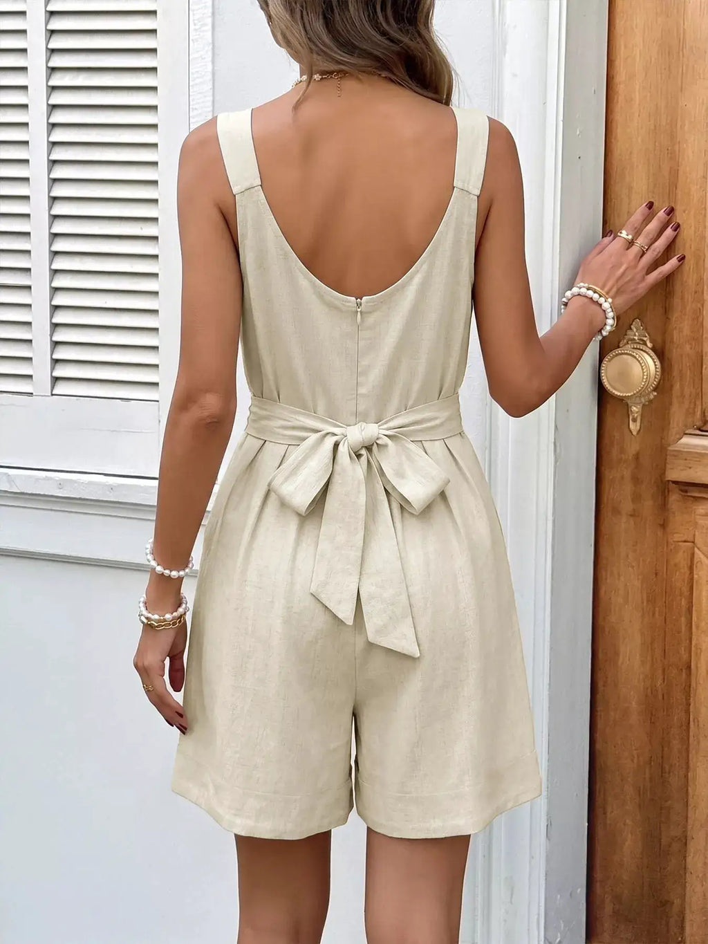 Bowknot Strap Pleated Detail Romper, beige linen-look fabric, back view with waist bow