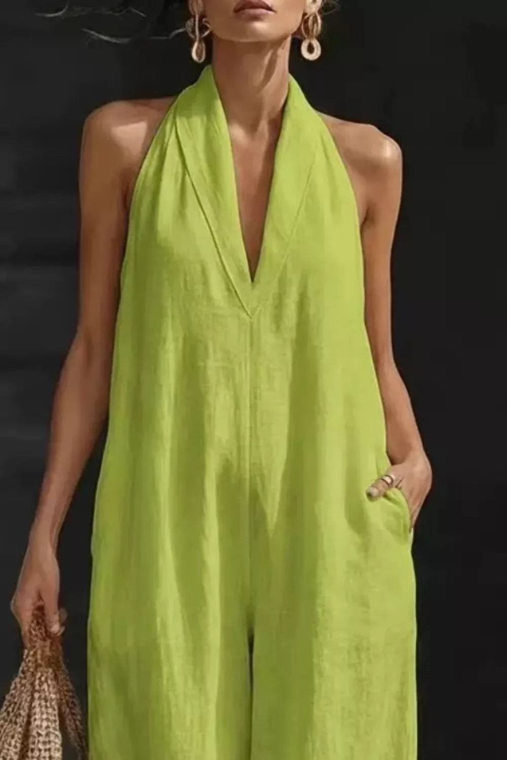 Sleeveless wide-leg jumpsuit in lime green with halter neckline and pockets by Trendsi