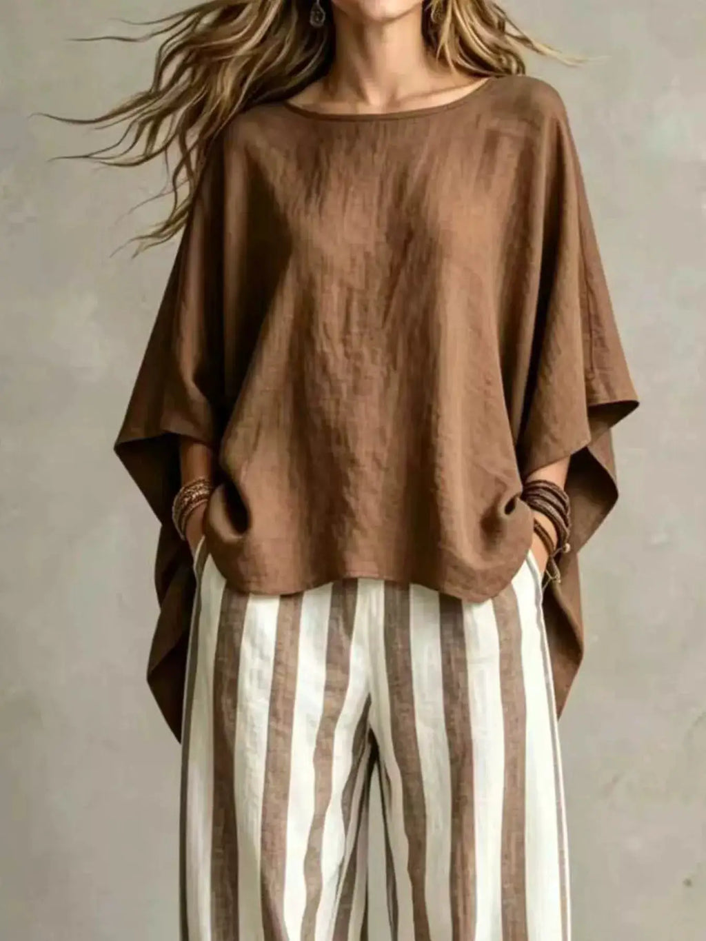 Plus-size outfit set by Belle Bijouix: oversized brown solid top with vertical brown and white striped pants