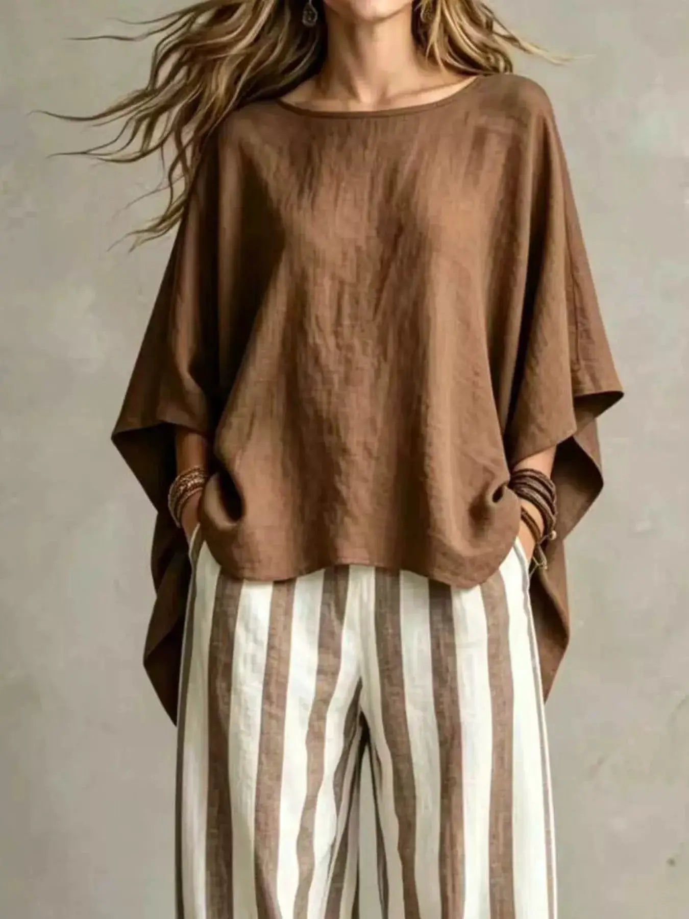 Plus-size outfit set by Belle Bijouix: oversized brown solid top with vertical brown and white striped pants