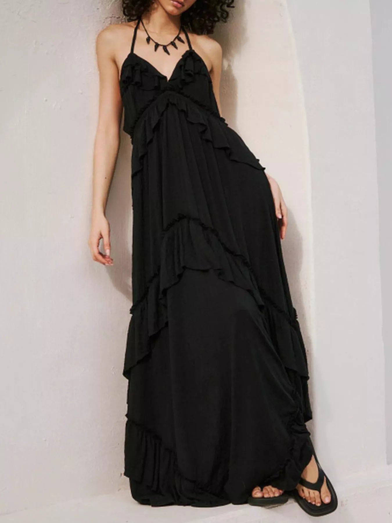 Ruffled halter-neck maxi dress in black with cascading layers