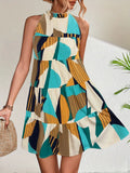 Printed Mock Neck Mini Dress in teal, cream, mustard geometric print with a tiered silhouette