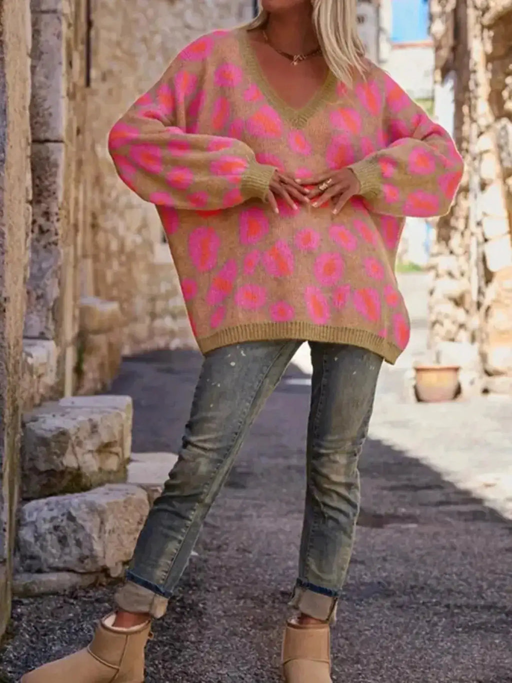 Leopard-print oversized V-neck sweater by Belle Bijouix; beige knit with pink spots, tops