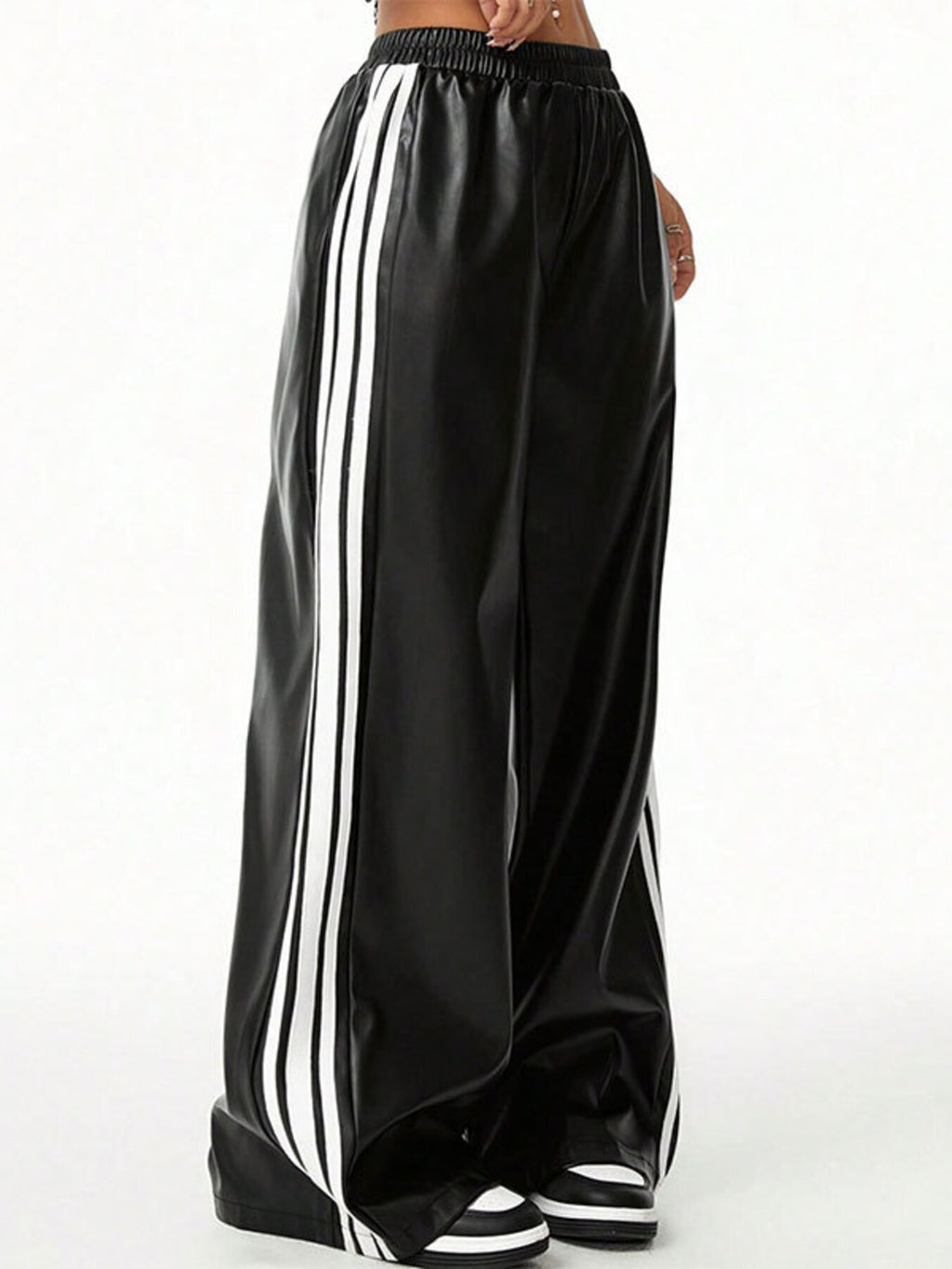 Striped wide-leg pants in black faux leather with white triple side stripes and elastic waistband