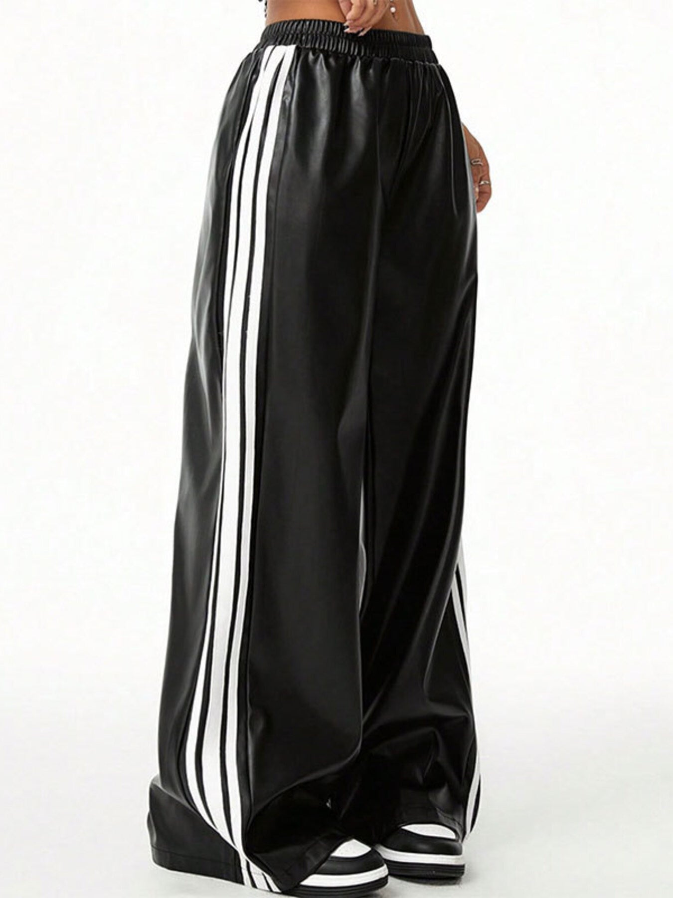 Striped wide-leg pants in black faux leather with white triple side stripes and elastic waistband