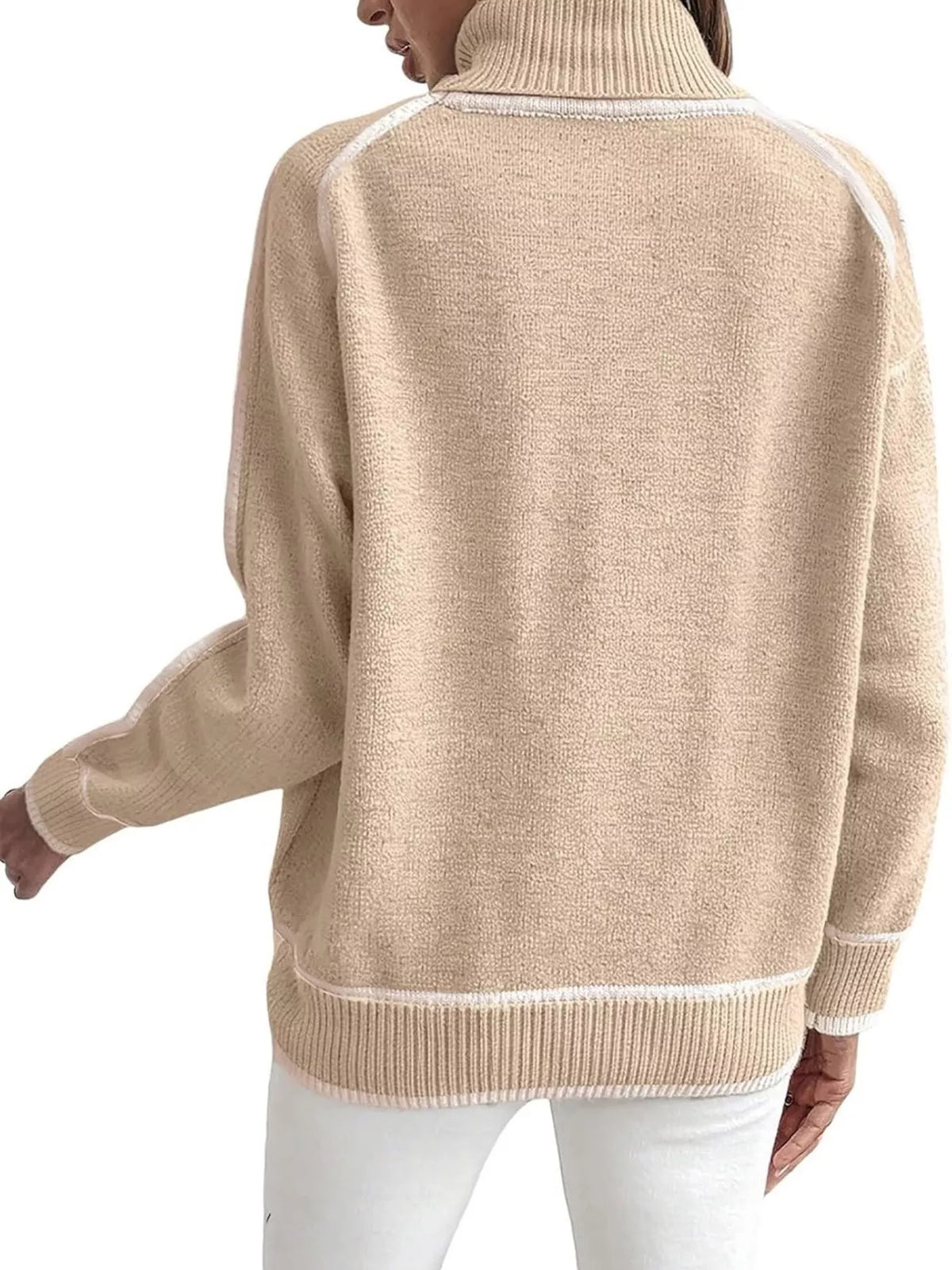 Back view of apricot turtleneck sweater with white contrast trim and ribbed hem