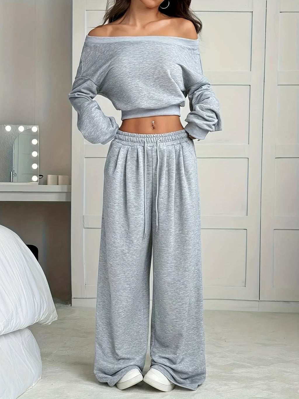 Two-piece plus-size gray heather lounge set with boat-neck crop top and wide-leg pants, pockets
