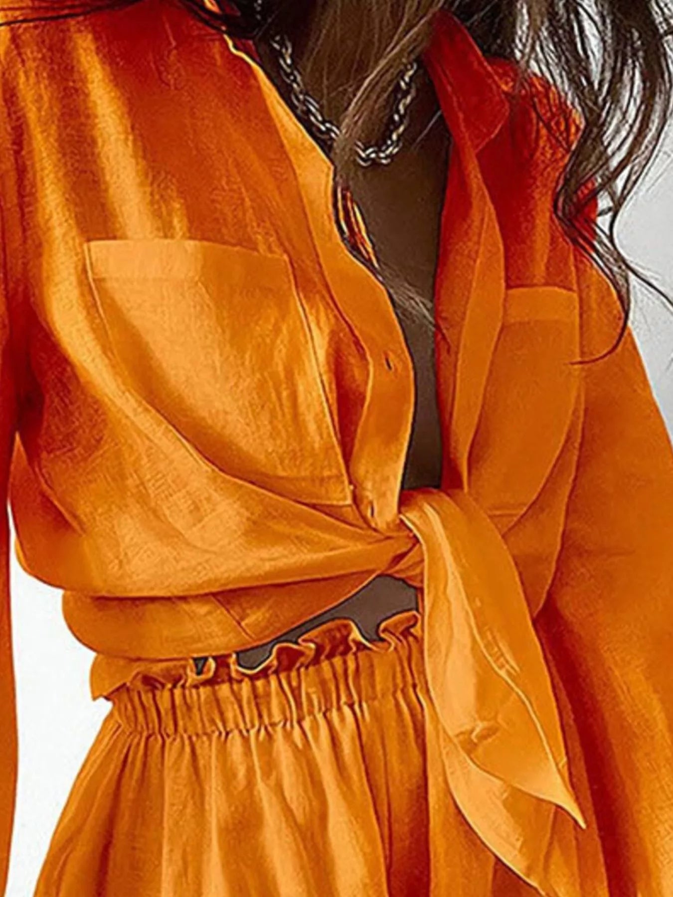 Button-up long-sleeve shirt and orange satin shorts set with waist tie