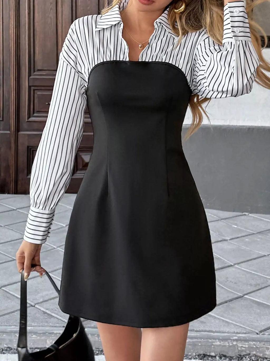 Striped shirt-panel bodycon mini dress by Belle Bijouix in black with white striped sleeves.