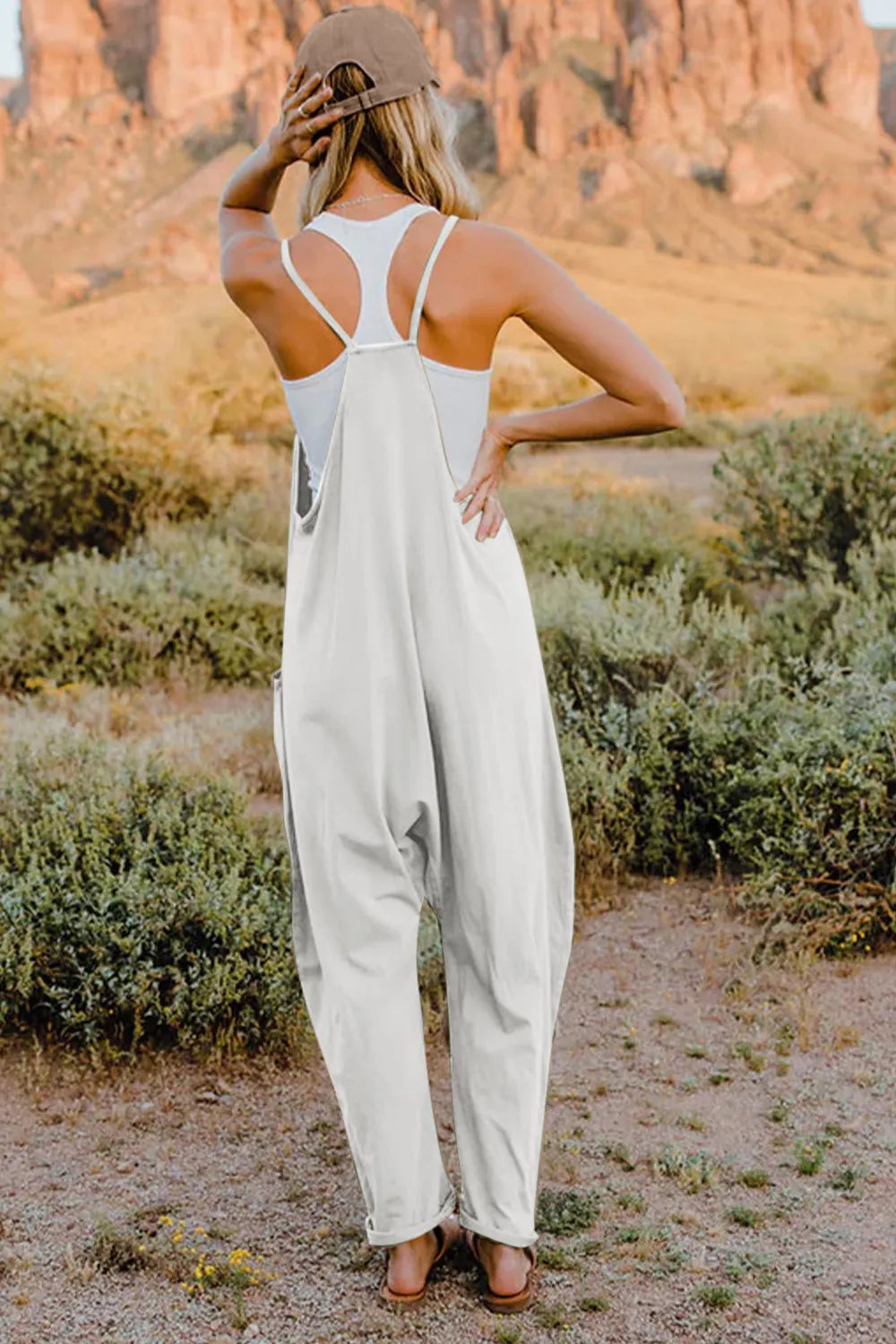Jumpsuit by Belle Bijouix, white sleeveless with back racerback and pockets