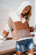 Hooded knit sweater by Belle Bijouix with openwork color-block in white, cream and rust; long sleeves