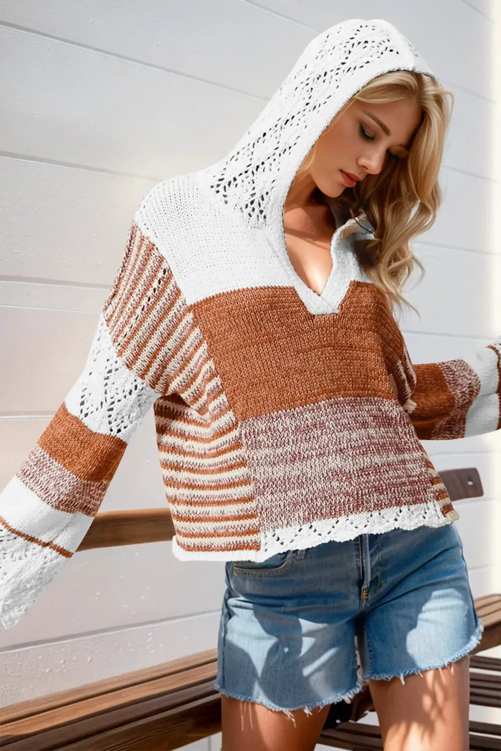 Hooded knit sweater by Belle Bijouix with openwork color-block in white, cream and rust; long sleeves