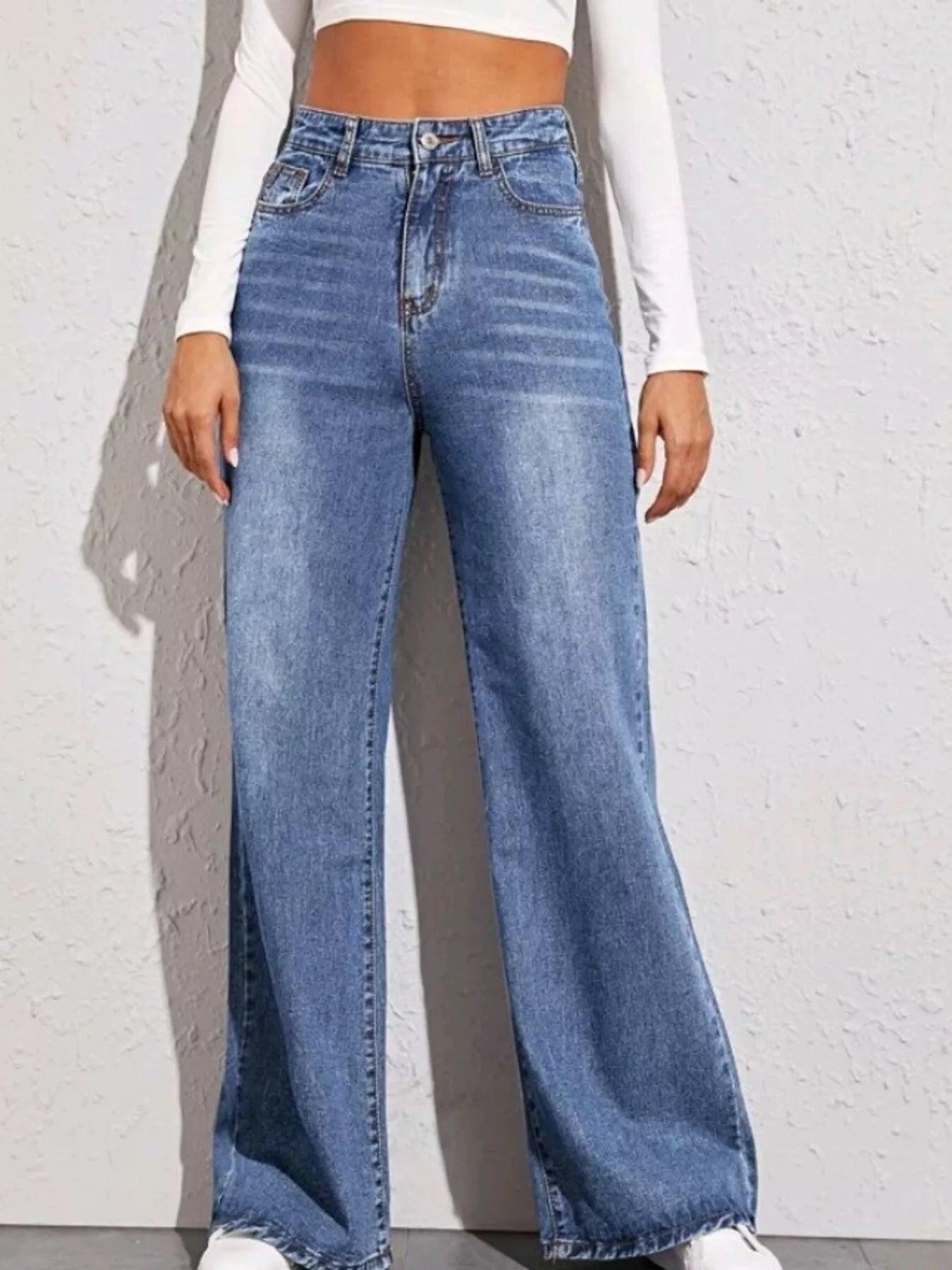 High-Waisted Wide Leg Jeans in light blue denim with wide legs and front pockets