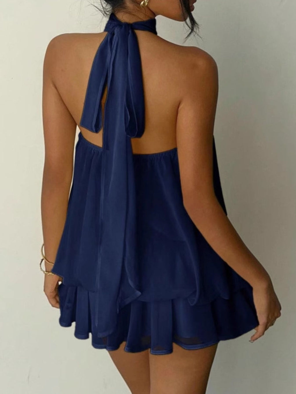 Halter Neck Layered Mini Dress in navy blue with back tie and tiered skirt