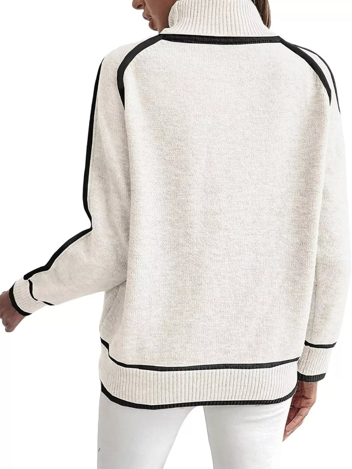 Back view of white turtleneck sweater with black contrast trim and ribbed hem