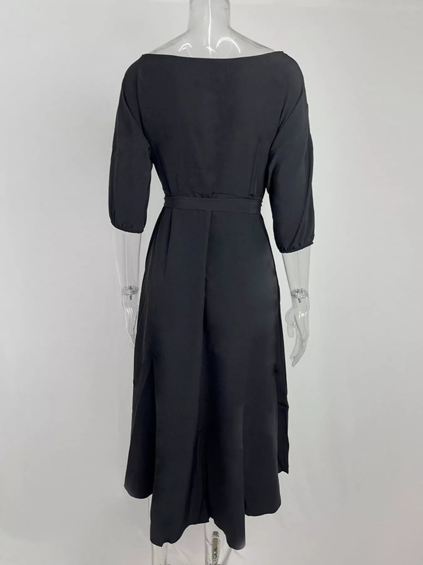 Boat neck tie-waist dress in black, back view on mannequin