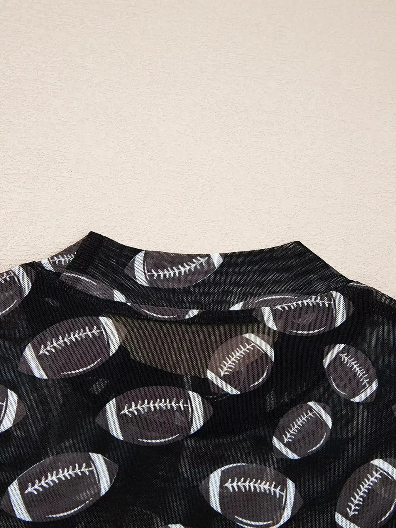 Game Day Mesh Sheer Long Sleeve Top, black mesh with football print.