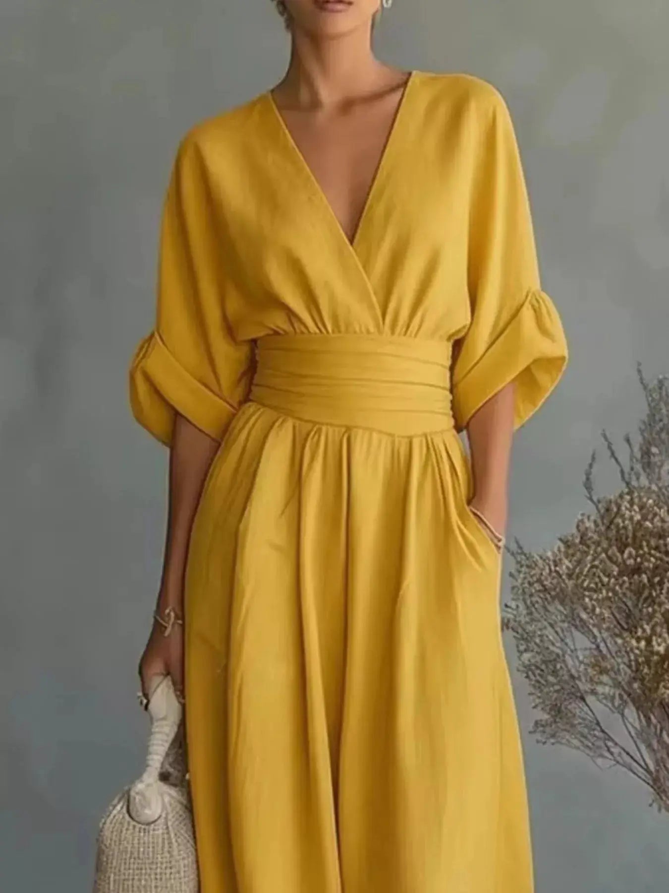 Plus-size wide-leg jumpsuit mustard yellow with wrapped V-neck and voluminous half sleeves