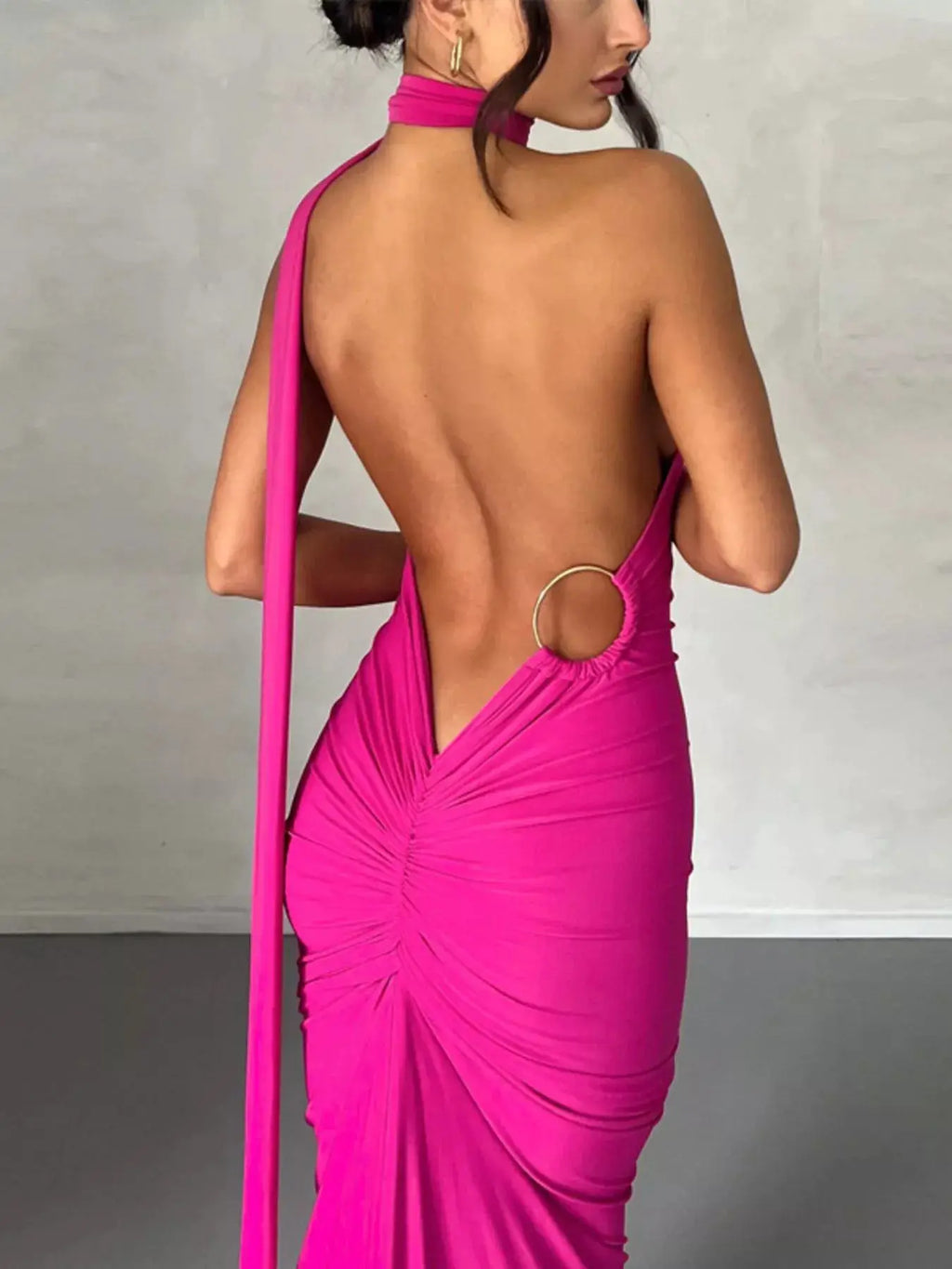 Backless one-shoulder ruched bodycon maxi dress in hot pink with circular back ring detail