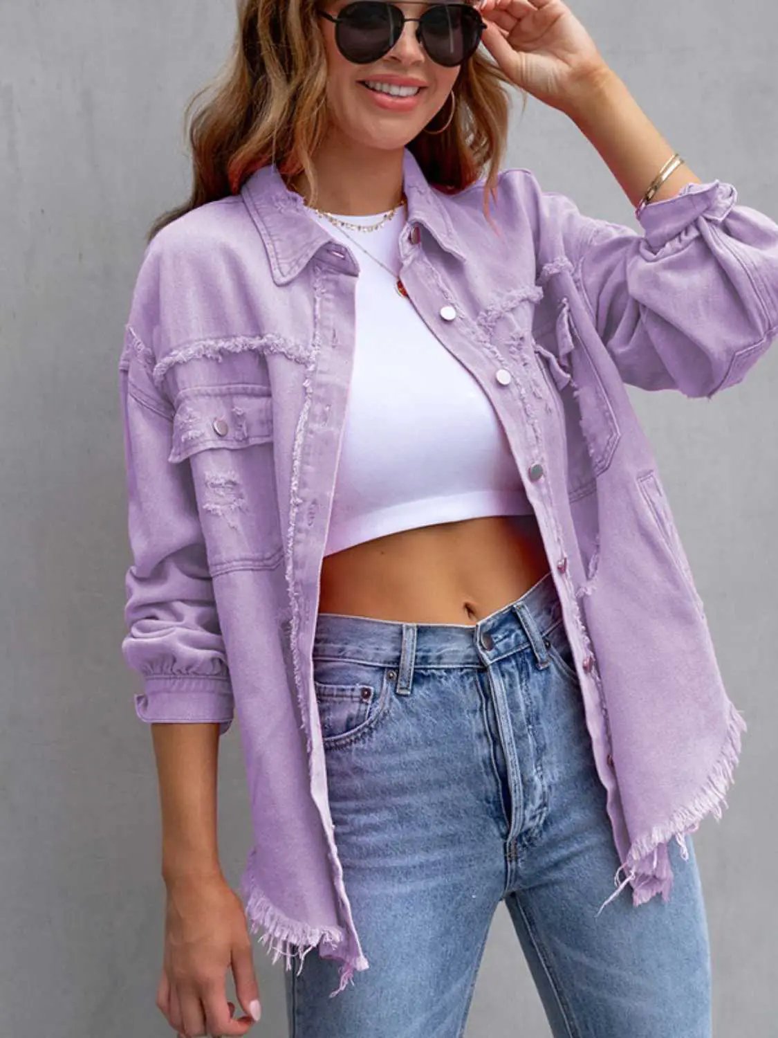 Distressed drop-shoulder denim jacket in lavender with frayed hems