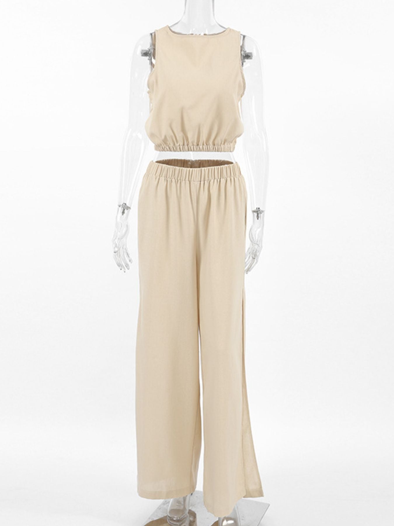 Sleeveless crop top and slit pants set by Belle Bijouix in beige